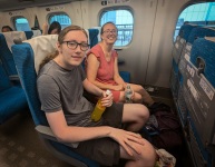 Kyle and Suzanne on the bullet train at Tokyo Station