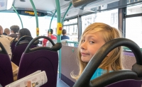 Kyle on a double decker bus in London